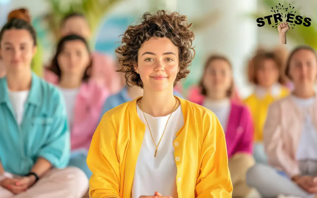 Stress Management Techniques. A person in a yellow jacket sits meditatively at the forefront, surrounded by a group of others seated in soft-focus. The word STRESS with a fist symbol is in the top right corner, symbolizing managing stress through meditation.